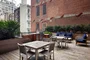 This lushly landscaped sun terrace complete with lounge chairs, tables and chairs provides the perfect setting to relax, refresh and recharge while enjoying views of the city.