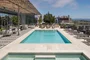 Swim, sunbathe, and socialize with the cityscape and bay as your backdrop on the rooftop pool and sun deck, which also features a hot tub, barbecues, heat lamps and access to the Pool House. 