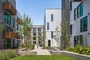 Landscaped courtyards with outdoor grills and dining