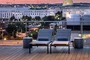 Landscaped rooftop with gunite swimming pool, two hot tubs, and resort-style sun terrace.