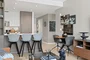 Open kitchen with custom cabinetry, premium stainless steel, gas appliances and flexible dining space