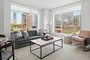 Gracious living space with hardwood floors and custom built-ins