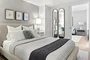 Spacious and comfortable primary bedroom with large closet space