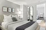 Spacious and comfortable primary bedroom with large closet space