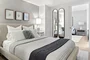 Spacious and comfortable primary bedroom with large closet space