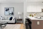 Open kitchen with custom cabinetry, premium stainless steel, gas appliances and flexible dining space