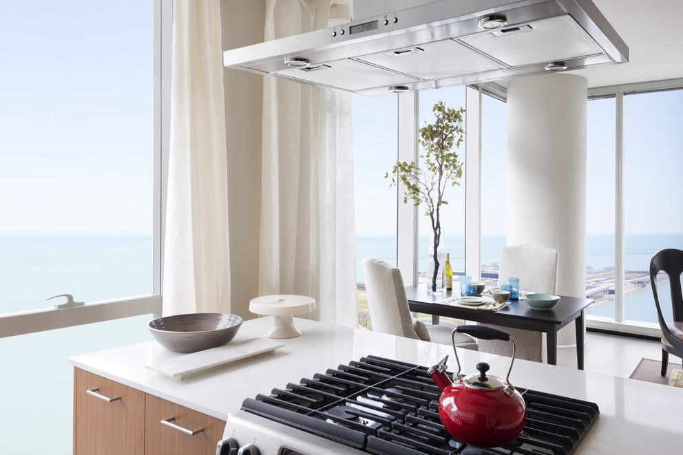 Gourmet kitchens include Snaidero duotone cabinetry, built-in appliances, and quartz countertops.