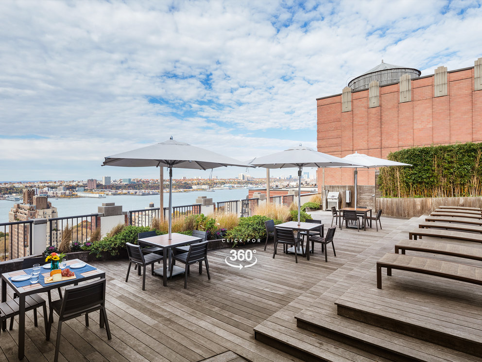 The landscaped rooftop sun terrace provides a perfect setting for enjoying gorgeous views of the city and the Hudson River.