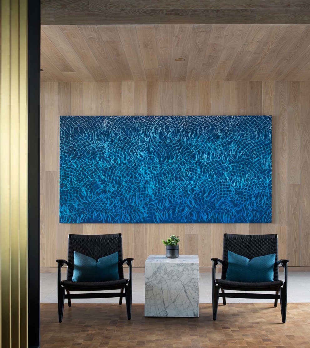 Reflecting the glistening water from the rooftop pool, David Huffman’s 10-foot painting Zenith, 2020 is perfectly located in Fifteen Fifty’s pool house.  