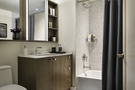 Imported Bianco Dolomite polished marble in bathrooms with marble mosaic feature walls.