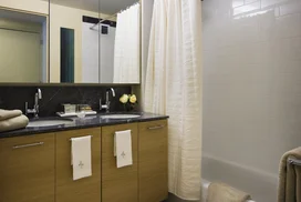 Custom bathrooms with Grigio Alfoni marble vanity tops and accents