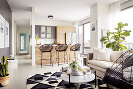 Spacious living rooms have nine-foot ceilings with floor-to-ceiling windows.