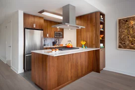 Gourmet kitchens include walnut cabinetry, Caesarstone countertops, and stainless steel KitchenAid® appliances.