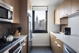 Tribeca Tower features gourmet kitchens with full-sized stainless steel appliances, custom wood cabinetry and white stone countertops. 