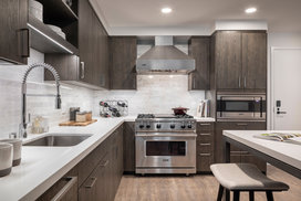 Townhome Kitchens include a suite of premium Viking appliances including a stainless steel gas range, refrigerator and dishwasher with integrated paneling and built-in microwave.