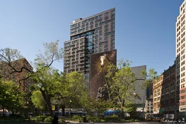 Facade features mixed-media art piece, The Metronome