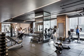 Equinox®-curated fitness center with yoga room, locker rooms and steam shower
