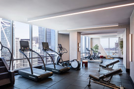 Equinox®-curated fitness center with yoga room, locker rooms and steam shower