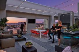 Rooftop terrace with dining tables and BBQ grills.