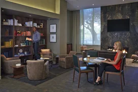 Fully wired technology lounge includes a coffee station.