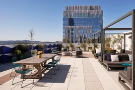 The lushly landscaped sun terrace is furnished with lounge chairs and shaded cabanas.