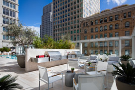 Take in breathtaking sunsets and city views from the rooftop BBQ terrace.