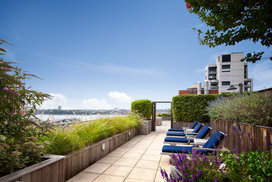 Perfectly planned landscaping on the rooftop terrace offers the ideal location to take in sweeping views of the Hudson River.