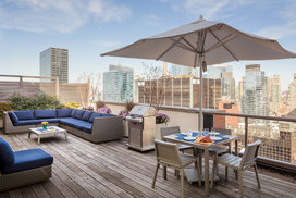 Stunning rooftop includes lounges and BBQ grills.