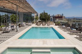 Swim, sunbathe, and socialize with the cityscape and bay as your backdrop on the rooftop pool and sun deck, which also features a hot tub, barbecues, heat lamps and access to the Pool House. 