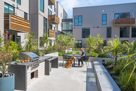 Landscaped courtyards with outdoor grills and dining