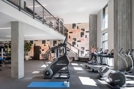 State-of-the-art fitness center with cardiovascular machines and Tonal’s strength-training system