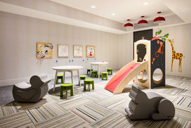 Families enjoy the children's playroom, designed with plenty of space for young explorers to get the wiggles out.