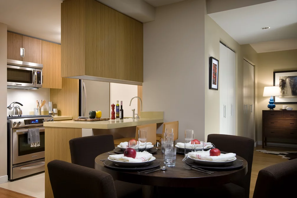 Gourmet kitchens are finished with quartzite stone countertops, sleek bamboo cabinetry, and stainless steel appliances.