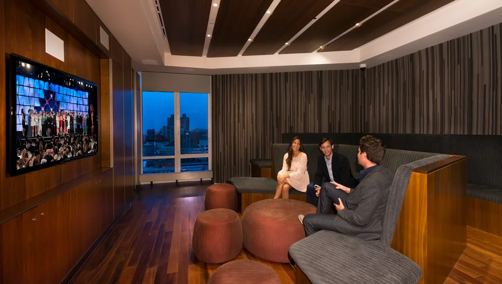 Located on the 20th floor with breathtaking Central Park views, the entertainment lounge features a 20-by-60 foot sitting area, billiards, a walnut paneled bar, and Venato Travertine hearth.