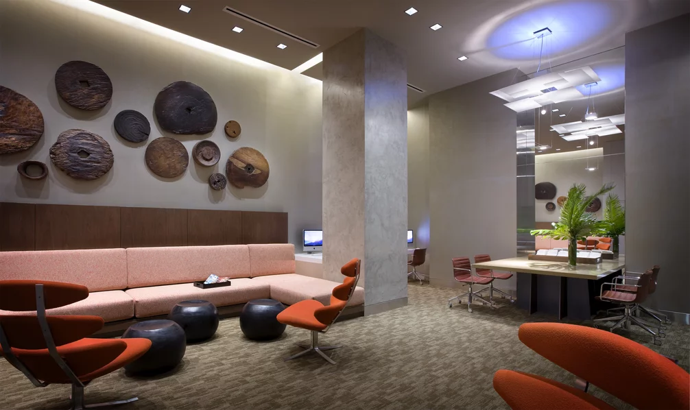 The Assouline Culture Lounge provides a luxurious space to relax next to a dramatic custom-designed graphite cement hearth.