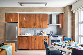Gourmet kitchens include walnut cabinetry, Caesarstone countertops, and stainless steel KitchenAid® appliances.