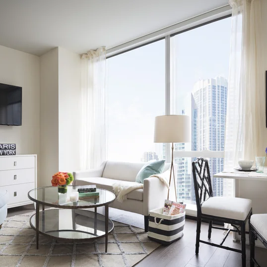 Custom-designed wide-plank wood flooring throughout residences