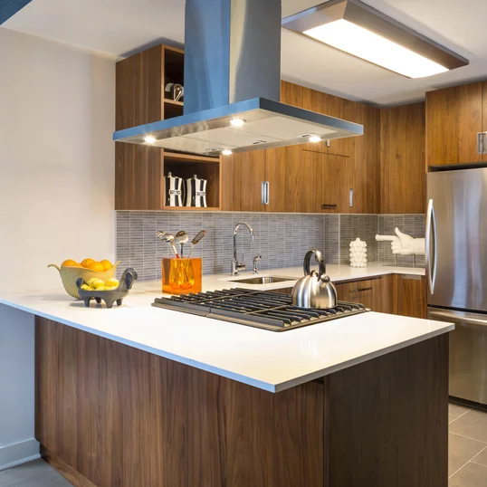 Gourmet kitchens include walnut cabinetry, Caesarstone countertops, and stainless steel KitchenAid® appliances.