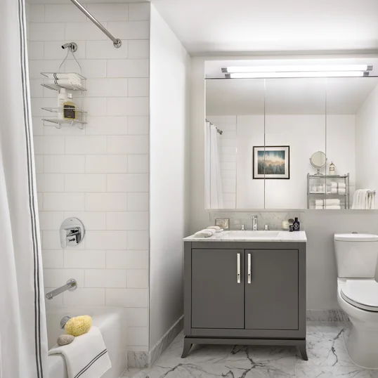 The Arlington's luxurious baths feature Italian marble floors, custom wood cabinetry, and oversized custom-designed medicine cabinets.