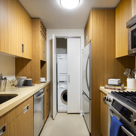 Superb kitchen finishes include quartzite stone countertops, bamboo cabinetry and stainless steel appliances.