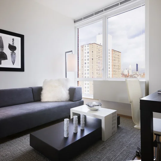 Open living and dining areas filled with light.