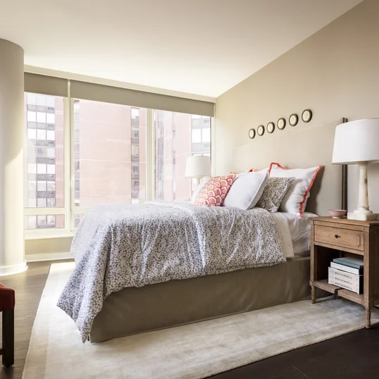 Over-sized windows frame Central Park, the river and open city views.