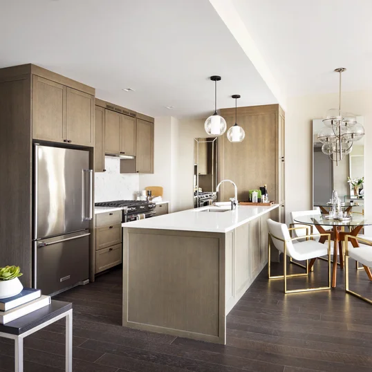 Top-of-the-line appliance suite featuring stainless steel refrigerator, gas range with oven, microwave in custom millwork pantry and integrated dishwasher.