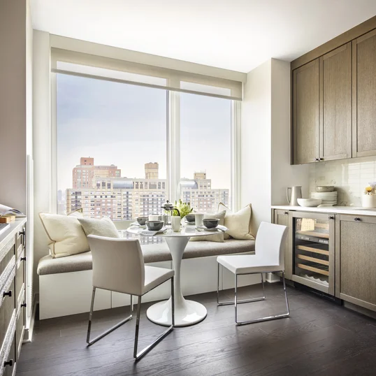 Top-of-the-line appliance suite featuring stainless steel refrigerator, gas range with oven, microwave in custom millwork pantry and integrated dishwasher.