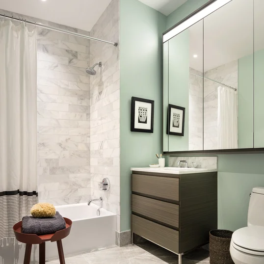 Master bathrooms feature Brazilian quartzite vanities and walls, St. Laurent marble floors and custom cabinetry.