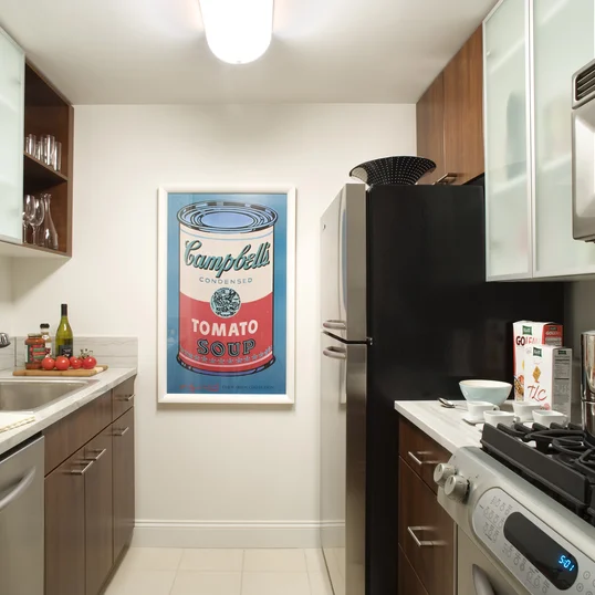 Gourmet stone kitchens feature stainless steel appliances, Euro-style walnut cabinetry, porcelain tile floors and glass accents.