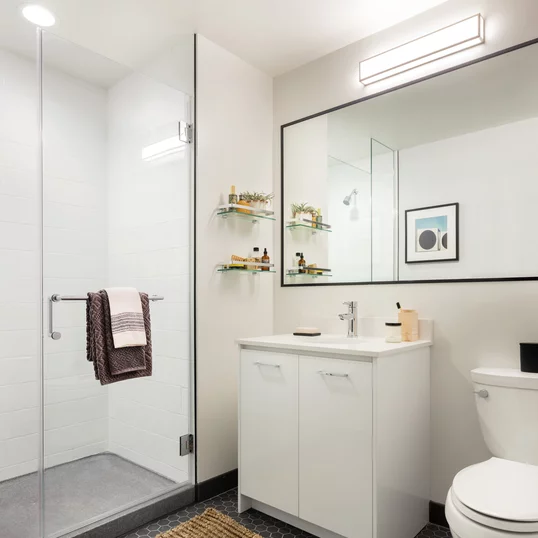 Classically tiled bathrooms feature oversized medicine cabinets.