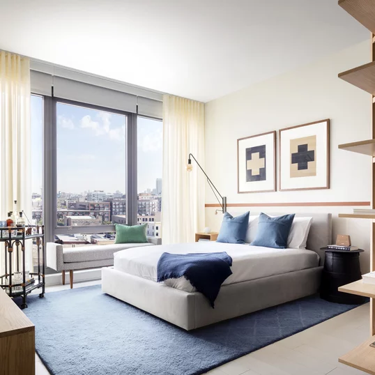 Large windows showcase city views.