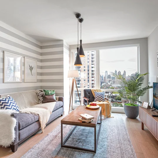 Floor to ceiling windows with sweeping city views