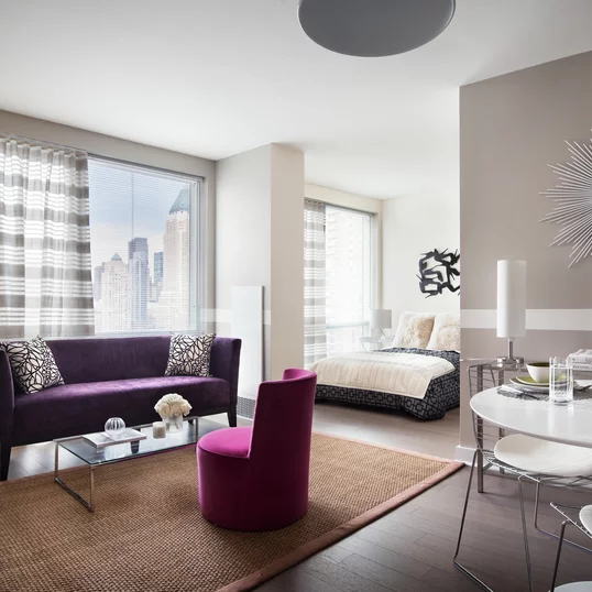 Floor to ceiling windows with sweeping city views
